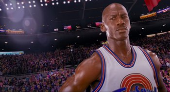 Movie still from “Space Jam” (1996), directed by Joe Pytka – A basketball player in front of an audience; Close Up shot, Low angle