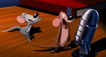 Movie still from “Space Jam” (1996), directed by Joe Pytka – Two animated dogs are standing on a wooden floor; Medium shot, Low angle