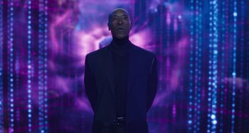 Movie still from “Space Jam: A New Legacy” (2021), directed by Malcolm D. Lee – A man standing in front of a purple background; Medium shot, Low angle
