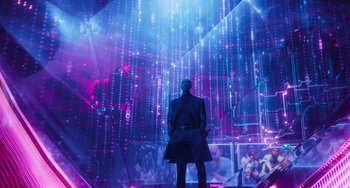 Movie still from “Space Jam: A New Legacy” (2021), directed by Malcolm D. Lee – A man standing in front of a wall of lights; Extreme Wide shot, Low angle