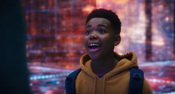 Movie still from “Space Jam: A New Legacy” (2021), directed by Malcolm D. Lee – A young boy with a surprised look on his face; Close Up shot, Over the shoulder angle