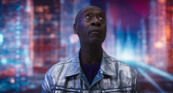 Movie still from “Space Jam: A New Legacy” (2021), directed by Malcolm D. Lee – A man in a silver jacket looking up at the sky; Close Up shot, Low angle