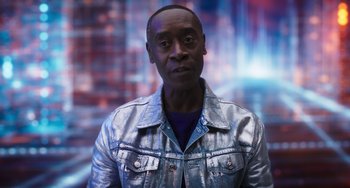 Movie still from “Space Jam: A New Legacy” (2021), directed by Malcolm D. Lee – A person wearing a silver jacket; Close Up shot, Low angle