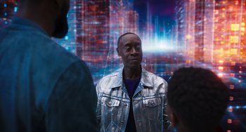 Movie still from “Space Jam: A New Legacy” (2021), directed by Malcolm D. Lee – A group of men standing around a building; Medium shot, Over the shoulder angle