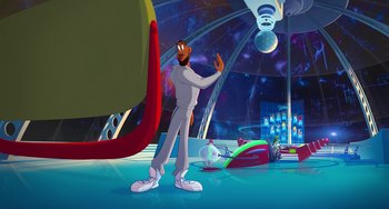 Movie still from “Space Jam: A New Legacy” (2021), directed by Malcolm D. Lee – A man standing in front of an audience in front of a stage; Wide shot, Low angle