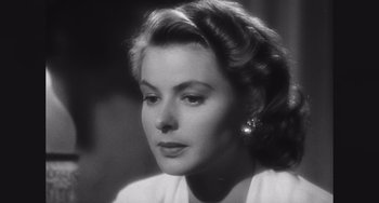 Movie still from “Space Jam: A New Legacy” (2021), directed by Malcolm D. Lee – A black - and - white photo of a woman in a white dress; Close Up shot, Low angle