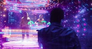 Movie still from “Space Jam: A New Legacy” (2021), directed by Malcolm D. Lee – A man and a woman in front of an illuminated stage; Wide shot, Over the shoulder angle