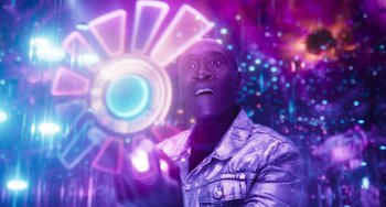 Movie still from “Space Jam: A New Legacy” (2021), directed by Malcolm D. Lee – A man in a silver jacket looking up at the sky; Close Up shot, Over the shoulder angle