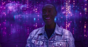 Movie still from “Space Jam: A New Legacy” (2021), directed by Malcolm D. Lee – A man in a denim jacket smiling for the camera; Close Up shot, Low angle