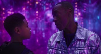 Movie still from “Space Jam: A New Legacy” (2021), directed by Malcolm D. Lee – A man and a boy face to face in front of a purple background; Close Up shot, Over the shoulder angle