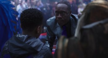 Movie still from “Space Jam: A New Legacy” (2021), directed by Malcolm D. Lee – A man in a suit talking to a young boy; Close Up shot, Over the shoulder angle