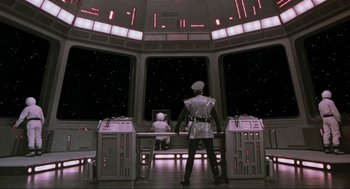 Movie still from “Spaceballs” (1987), directed by Mel Brooks – A man and a child in a space station; Wide shot, Low angle