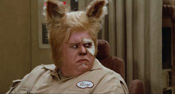 Movie still from “Spaceballs” (1987), directed by Mel Brooks – A man that is wearing some sort of wig; Close Up shot, Over the shoulder angle