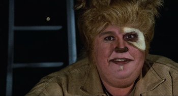 Movie still from “Spaceballs” (1987), directed by Mel Brooks – A woman with a cat face paint on her face; Close Up shot, Over the shoulder angle