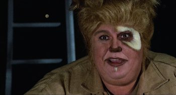 Movie still from “Spaceballs” (1987), directed by Mel Brooks – A woman with a cat face paint on her face; Close Up shot, Low angle