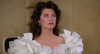 Movie still from “Spaceballs” (1987), directed by Mel Brooks – A woman in a white dress looking to her left; Close Up shot, Low angle