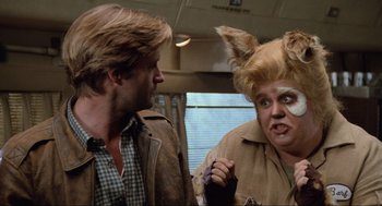 Movie still from “Spaceballs” (1987), directed by Mel Brooks – A man and a woman in a room with a window in front of them; Close Up shot, Over the shoulder angle