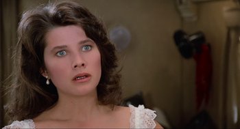 Movie still from “Spaceballs” (1987), directed by Mel Brooks – A person wearing a white dress; Close Up shot, Over the shoulder angle