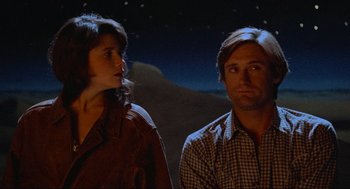Movie still from “Spaceballs” (1987), directed by Mel Brooks – A man and a woman standing next to each other; Close Up shot, Low angle