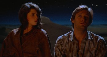 Movie still from “Spaceballs” (1987), directed by Mel Brooks – A man and a woman standing next to each other; Medium shot, Low angle