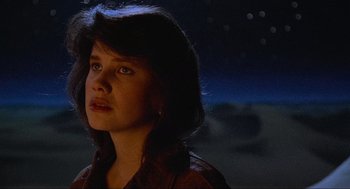 Movie still from “Spaceballs” (1987), directed by Mel Brooks – A young woman is looking up at the sky at night; Close Up shot, Low angle