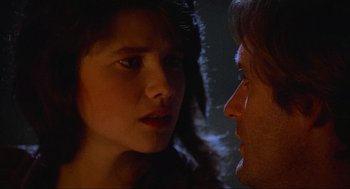 Movie still from “Spaceballs” (1987), directed by Mel Brooks – A man and a woman face to face in the dark; Close Up shot, Over the shoulder angle