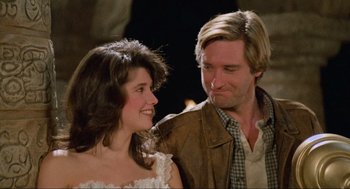 Movie still from “Spaceballs” (1987), directed by Mel Brooks – A man and a woman standing next to each other; Close Up shot, Over the shoulder angle