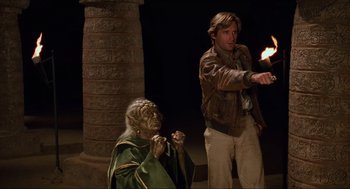 Movie still from “Spaceballs” (1987), directed by Mel Brooks – A man and a woman are standing next to each other; Medium shot, Over the shoulder angle