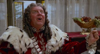 Movie still from “Spaceballs” (1987), directed by Mel Brooks – An older man in a wig and a fur coat; Close Up shot, Low angle