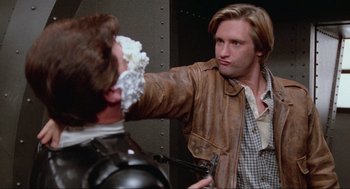 Movie still from “Spaceballs” (1987), directed by Mel Brooks – A man is shaving another man's face with a razor; Close Up shot, Over the shoulder angle