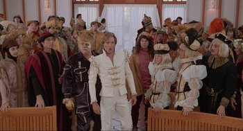 Movie still from “Spaceballs” (1987), directed by Mel Brooks – A group of people dressed in costumes in front of a door; Wide shot, Low angle