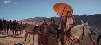 Movie still from “Spartacus” (1960), directed by Stanley Kubrick – A group of men standing next to each other; Wide shot, Low angle