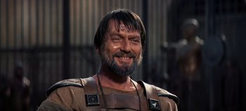 Movie still from “Spartacus” (1960), directed by Stanley Kubrick – A person with a beard; Close Up shot, Low angle