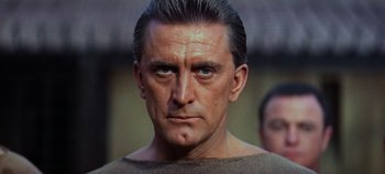 Movie still from “Spartacus” (1960), directed by Stanley Kubrick – A man's face in a 3 - d image; Close Up shot, Low angle