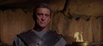 Movie still from “Spartacus” (1960), directed by Stanley Kubrick – A person wearing a costume; Close Up shot, Low angle