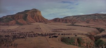 Movie still from “Spartacus” (1960), directed by Stanley Kubrick – A group of people standing in the middle of a field; Extreme Wide shot, High angle