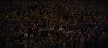 Movie still from “Spartacus” (1960), directed by Stanley Kubrick – A large group of people standing together in a dark room; Extreme Wide shot, High angle