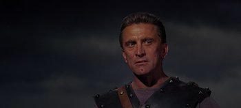 Movie still from “Spartacus” (1960), directed by Stanley Kubrick – A person wearing a costume; Close Up shot, Low angle