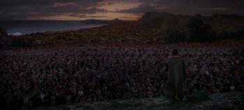 Movie still from “Spartacus” (1960), directed by Stanley Kubrick – A crowd of people gathered in a field at night; Extreme Wide shot, High angle