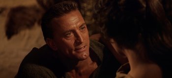 Movie still from “Spartacus” (1960), directed by Stanley Kubrick – A person wearing a sweater; Close Up shot, Over the shoulder angle