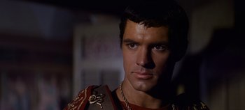 Movie still from “Spartacus” (1960), directed by Stanley Kubrick – A person wearing a uniform; Close Up shot, Over the shoulder angle
