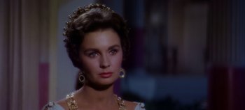 Movie still from “Spartacus” (1960), directed by Stanley Kubrick – A person wearing a dress; Close Up shot, Over the shoulder angle