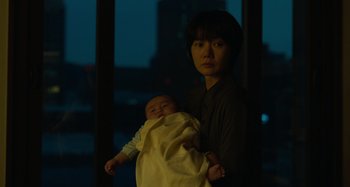 Movie still from “Broker” (2022), directed by Kore-eda Hirokazu – Medium shot, Low angle