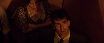 Movie still from “Speed” (1994), directed by Jan de Bont – A man and a woman in a dark room; Close Up shot, High angle