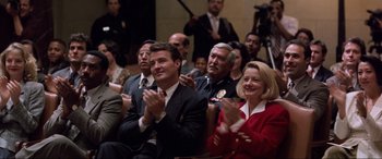 Movie still from “Speed” (1994), directed by Jan de Bont – A group of people clapping in a room; Medium shot, High angle