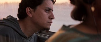 Movie still from “Speed” (1994), directed by Jan de Bont – A man with a beard looking out a window; Close Up shot, Low angle