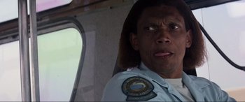 Movie still from “Speed” (1994), directed by Jan de Bont – A person with long hair; Close Up shot, Low angle