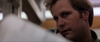 Movie still from “Speed” (1994), directed by Jan de Bont – A person looking at the camera; Close Up shot, Low angle