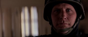 Movie still from “Speed” (1994), directed by Jan de Bont – A person wearing a helmet; Close Up shot, Low angle