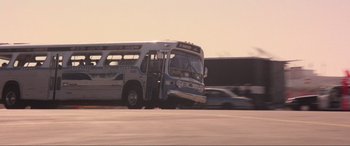 Movie still from “Speed” (1994), directed by Jan de Bont – A bus that is sitting on the side of the road; Extreme Wide shot, Low angle